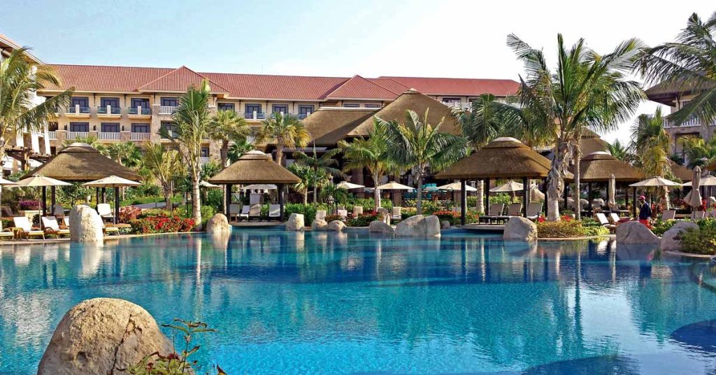Cape Reed thatched roofs with timber decking and poolside seating