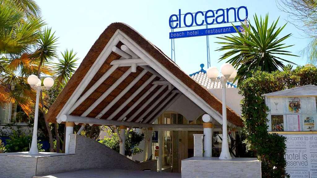 Restaurant whitewashed thatched roof entrance