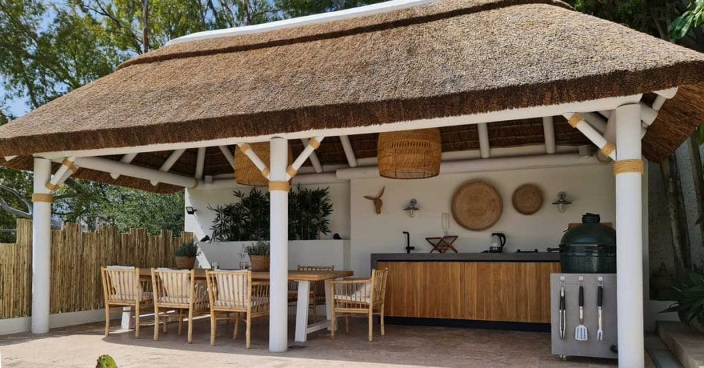Whitewash African thatched gazebo with a Boho Chic theme