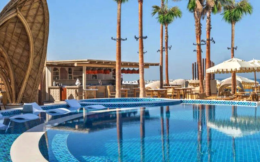 Kaimana Beach outdoor timber pergola and bar area installed by Cape Reed on the Palm Jumeirah, Dubai