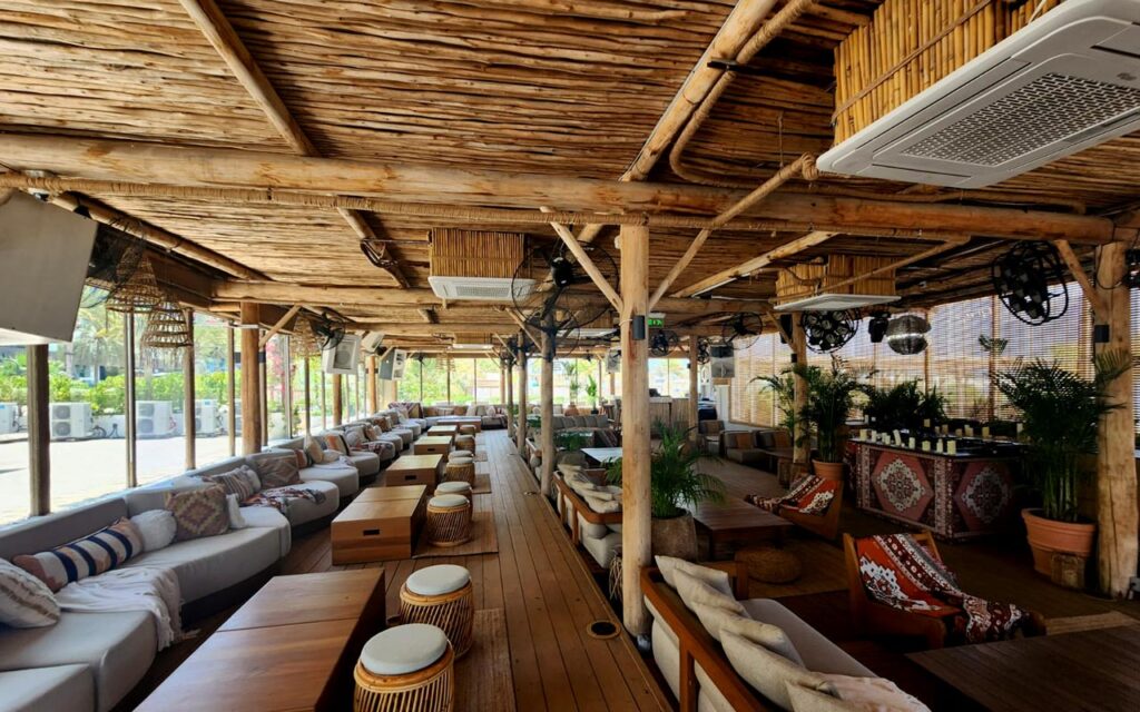 Surf Club at Palm West Beach featuring Cape Reed timber decking, wooden pergola framework and lath screens