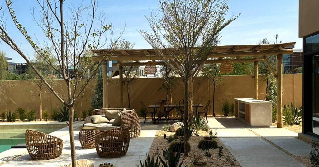 Timber pergola with built-in outdoor kitchen and lounge seating, Abu Dhabi villa